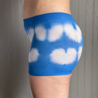 side profile of cobalt blue, shibori pattern postpartum underwear on body