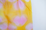 close up of shiboir pattern on postpartum underwear. Grapefruit colour